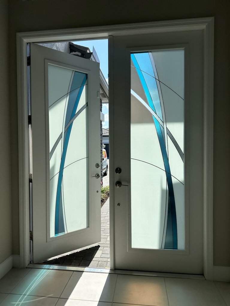 Blue geometric accents on double entry doors