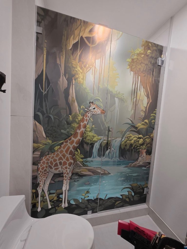 Wildlife scene artwork viewed across an angled shower enclosure
