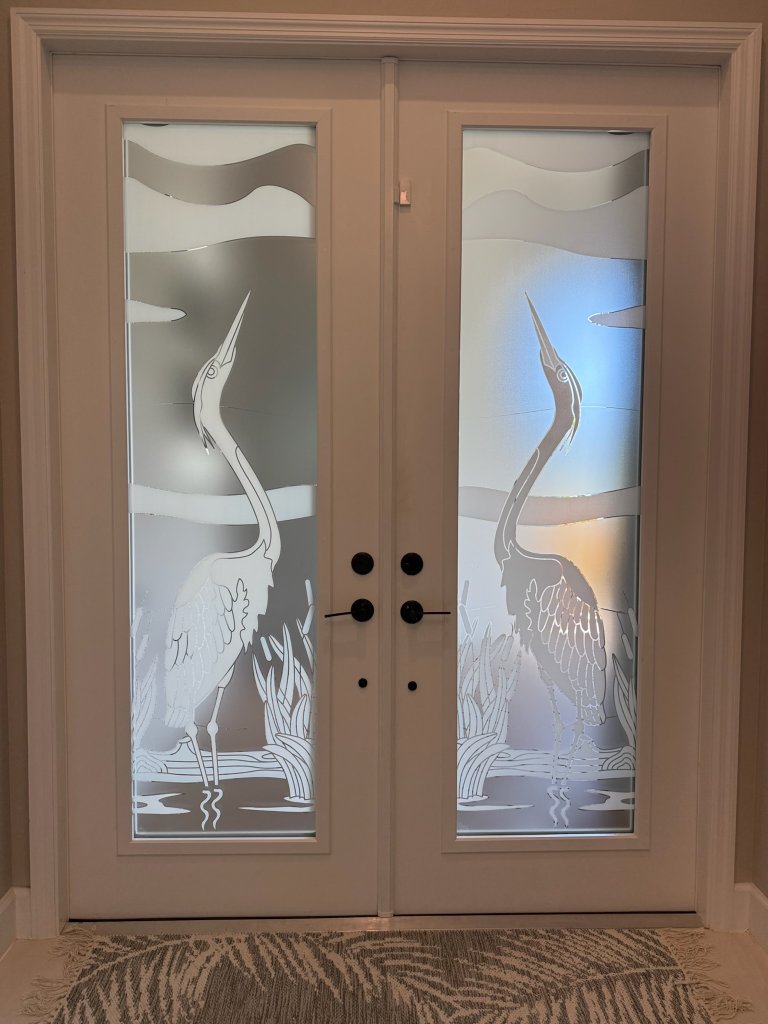 Heron artwork on double entry-door panes