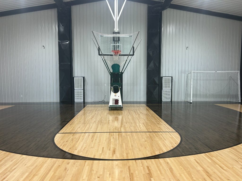 Basketball hoop and shooting machine on the court