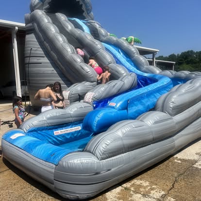 Life Unlimited full-service event setup with multiple inflatables