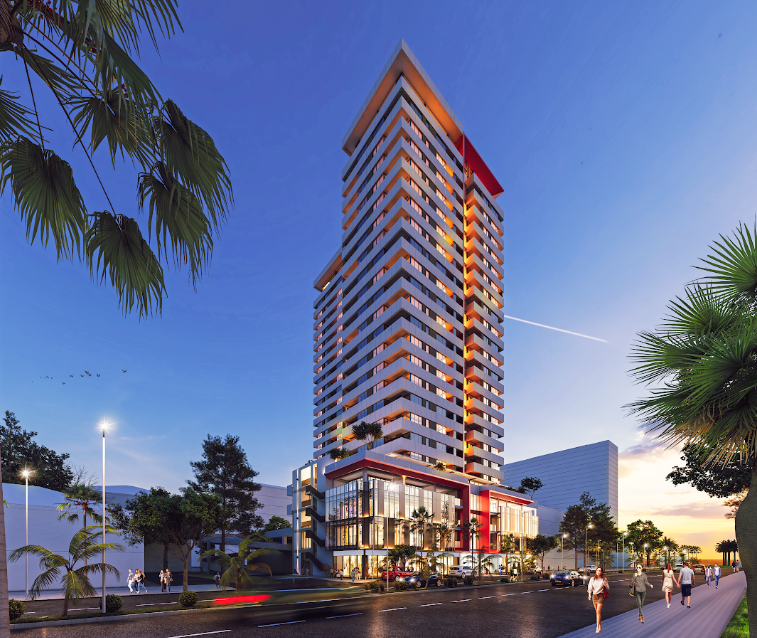 Mardi Stadium residential tower and illuminated podium at blue hour