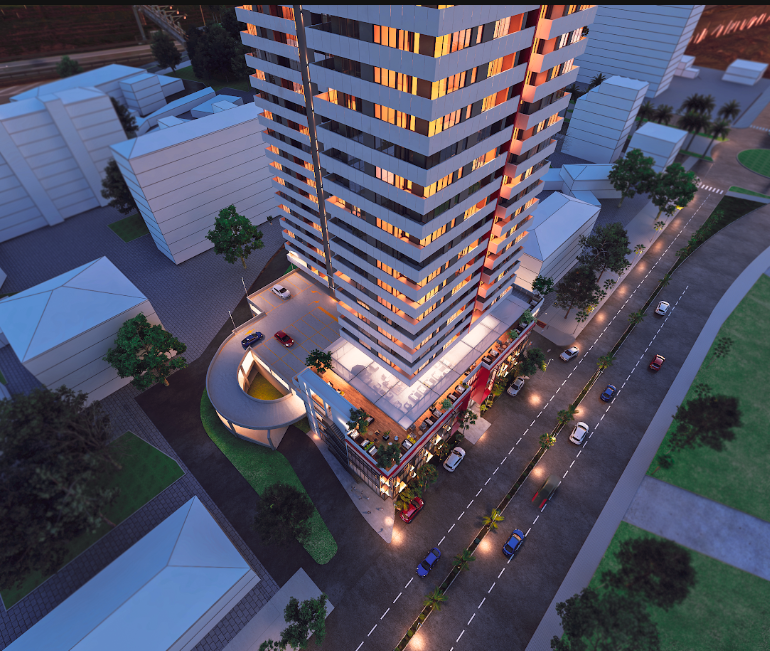 Aerial view of the Mardi Stadium tower, parking and palm-lined street