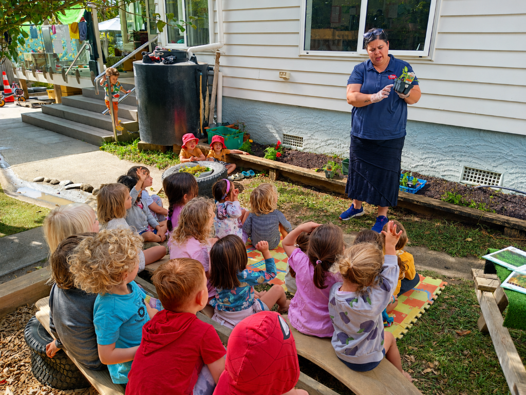 Experienced early childhood teacher interacting warmly with children