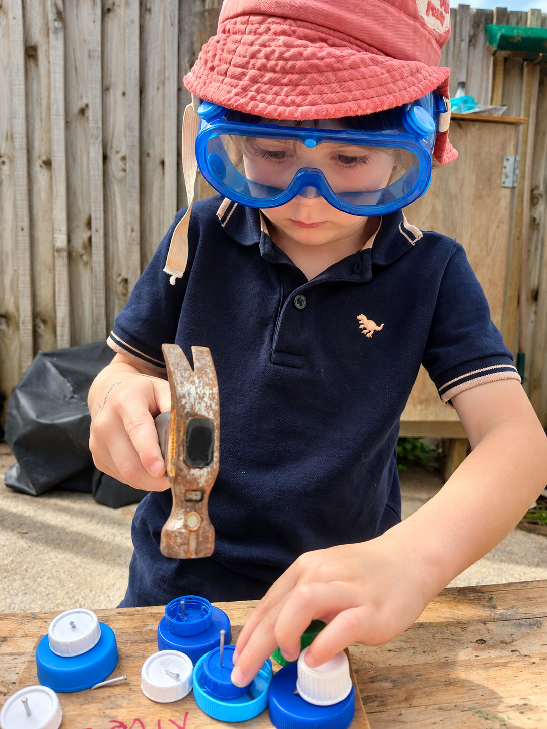 Explorer hammering at the workbench