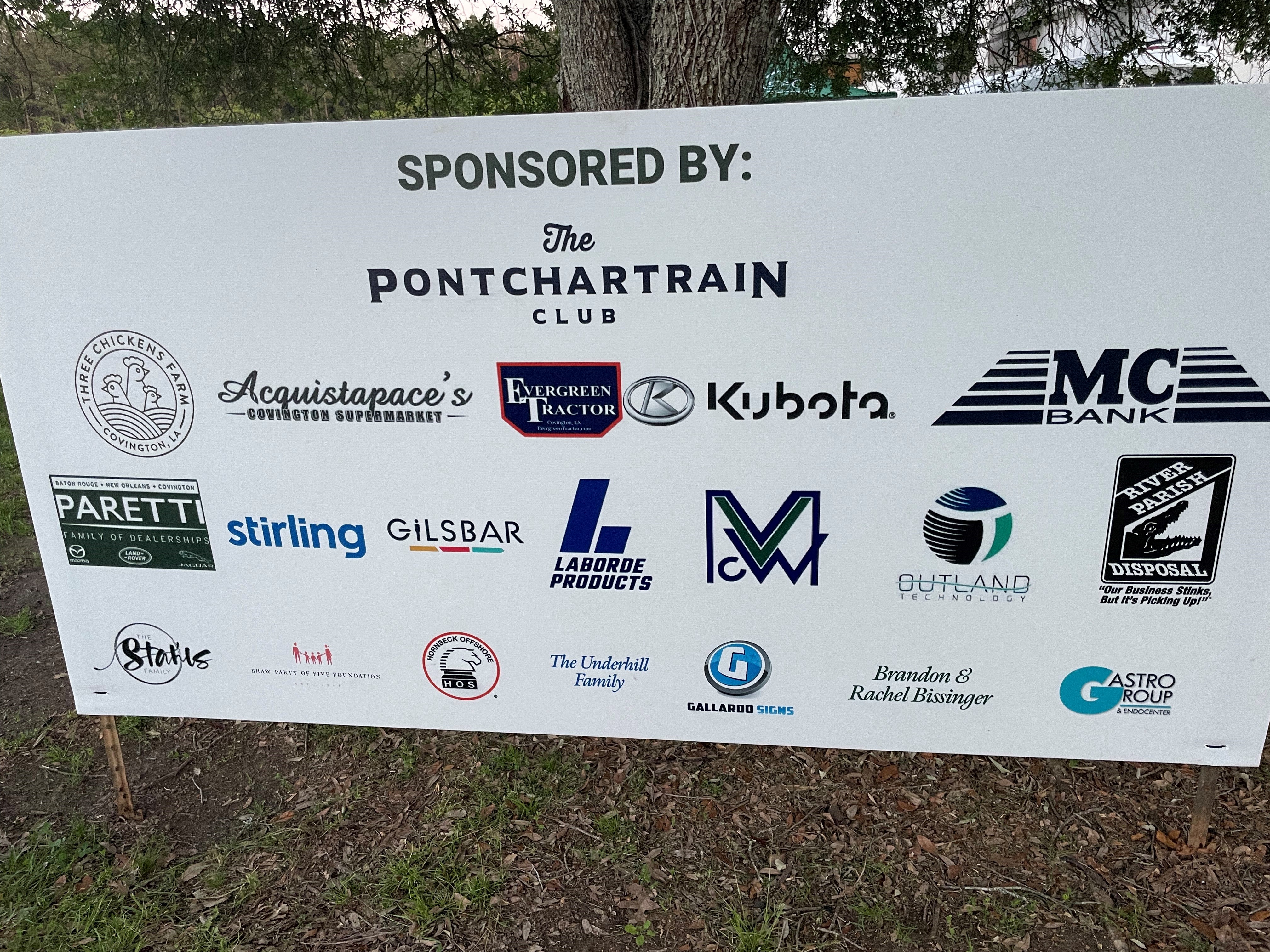 Sponsored by sign for the Pontchartrain Club Farm Fete featuring the Evergreen Tractor and Kubota logos