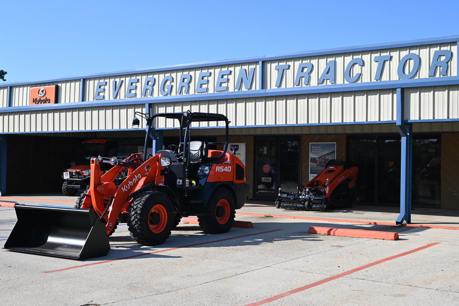 Kubota R540 wheel loader with bucket in front of Evergreen Tractor