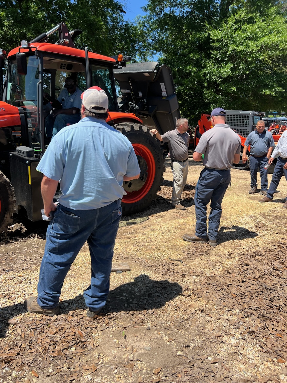 Evergreen Tractor team demonstrating a Kubota tractor to municipal customers