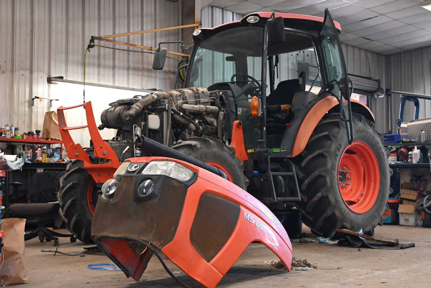 Kubota M5-091 tractor disassembled for repair inside the Evergreen Tractor service shop