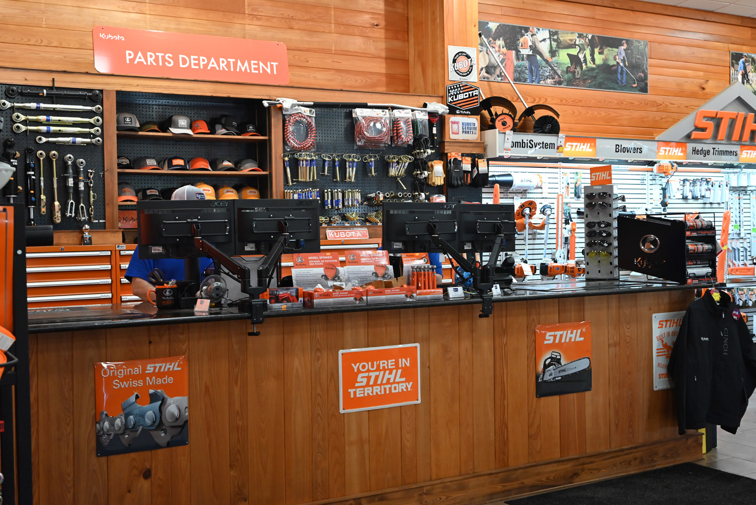 Evergreen Tractor parts department counter with Kubota and STIHL merchandise in Covington, LA