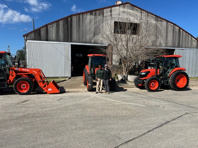 Evergreen Tractor dealership with Kubota tractors in front of the service shop