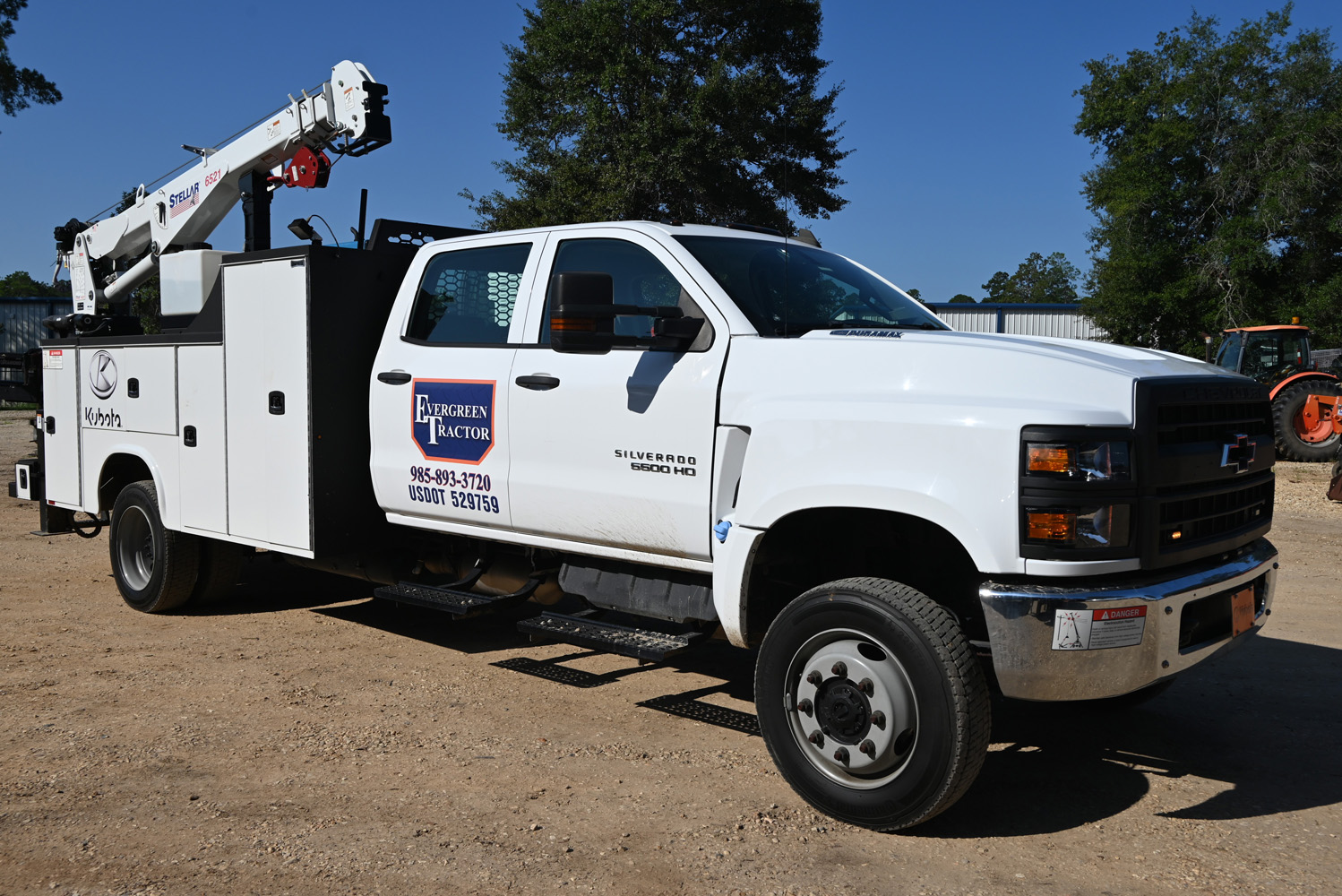 Evergreen Tractor mobile service truck with crane ready for field repairs