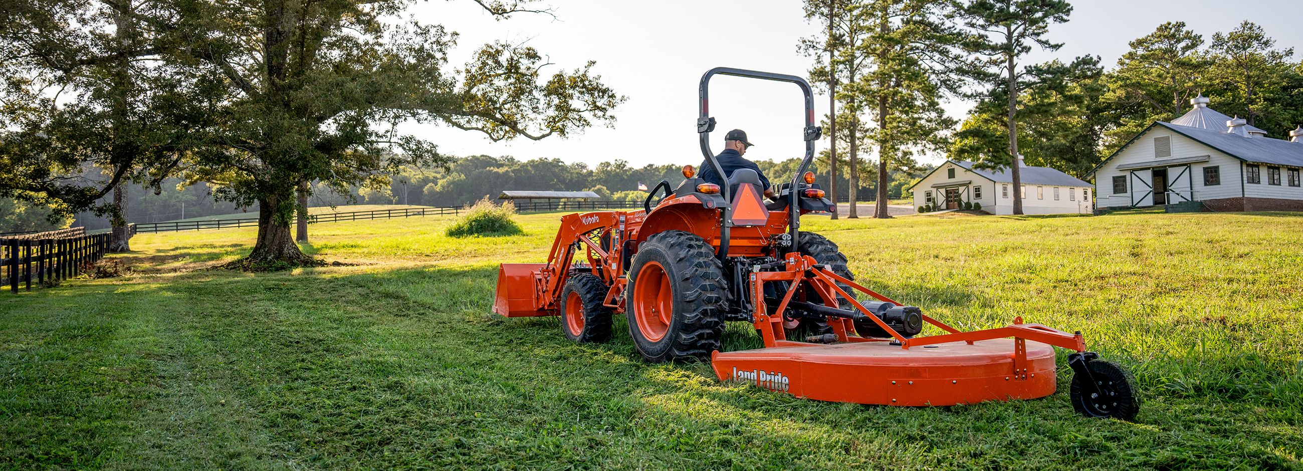 Kubota tractor running a Land Pride rotary cutter attachment
