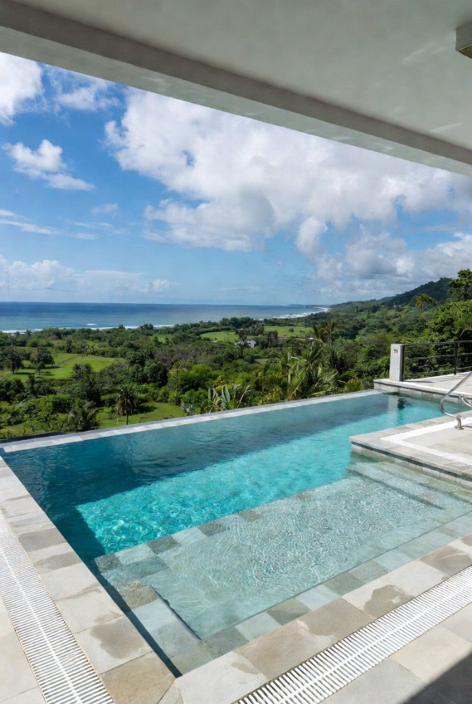 Infinity edge pool with panoramic ocean view