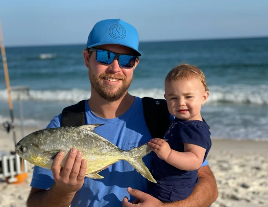 Charter guest Dad & Kid with a catch on a Pensacola land-based charter