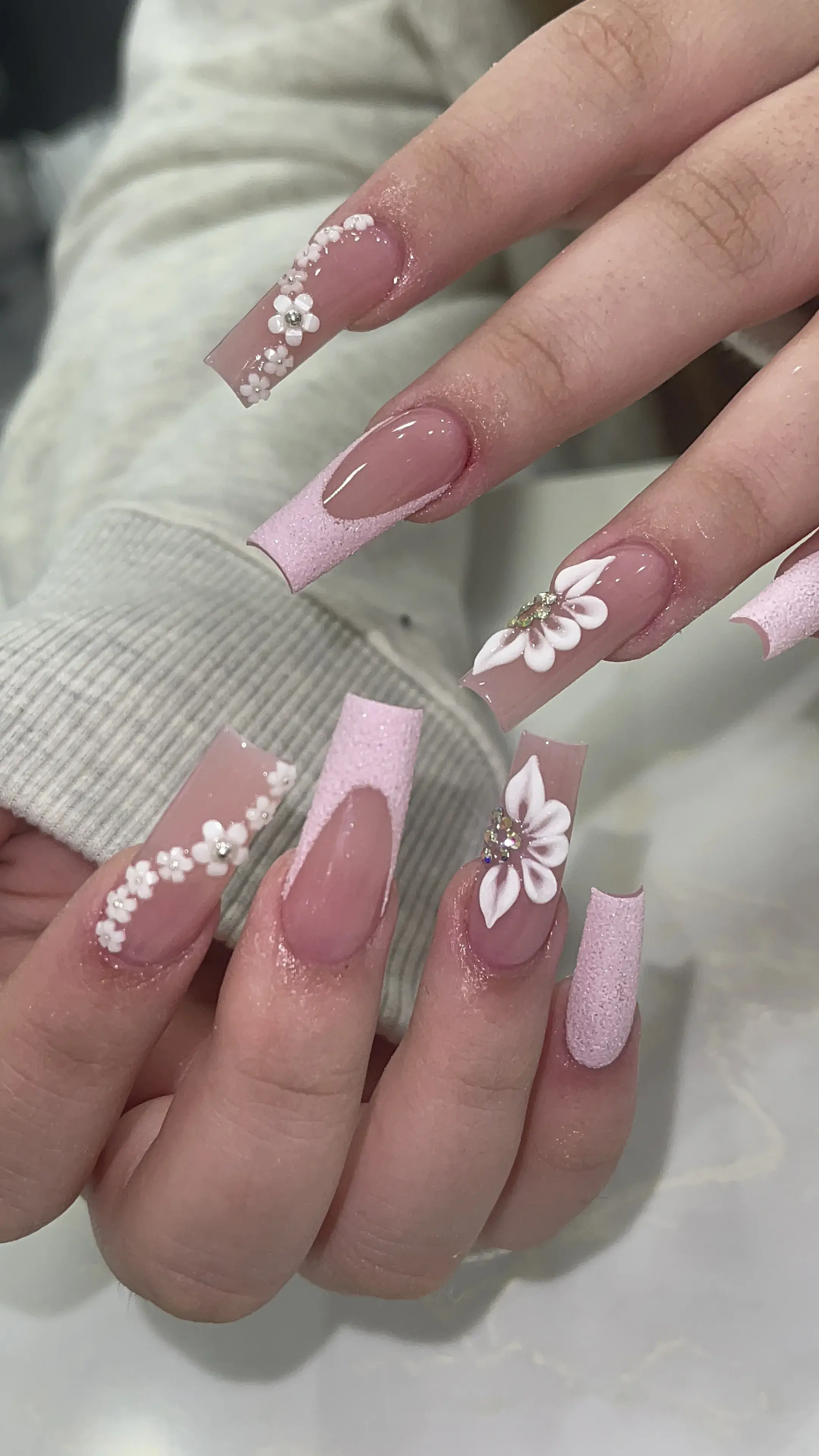 Pink glitter coffin nails with 3D white flower and rhinestones