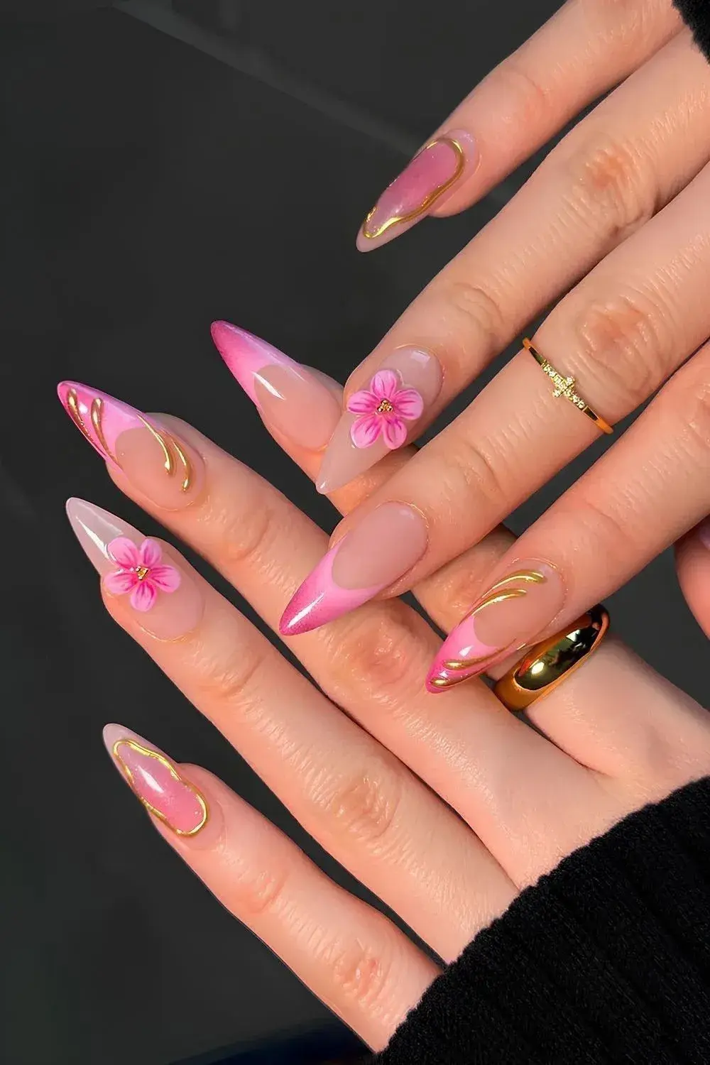 Pink stiletto nails with gold swirl and 3D flower