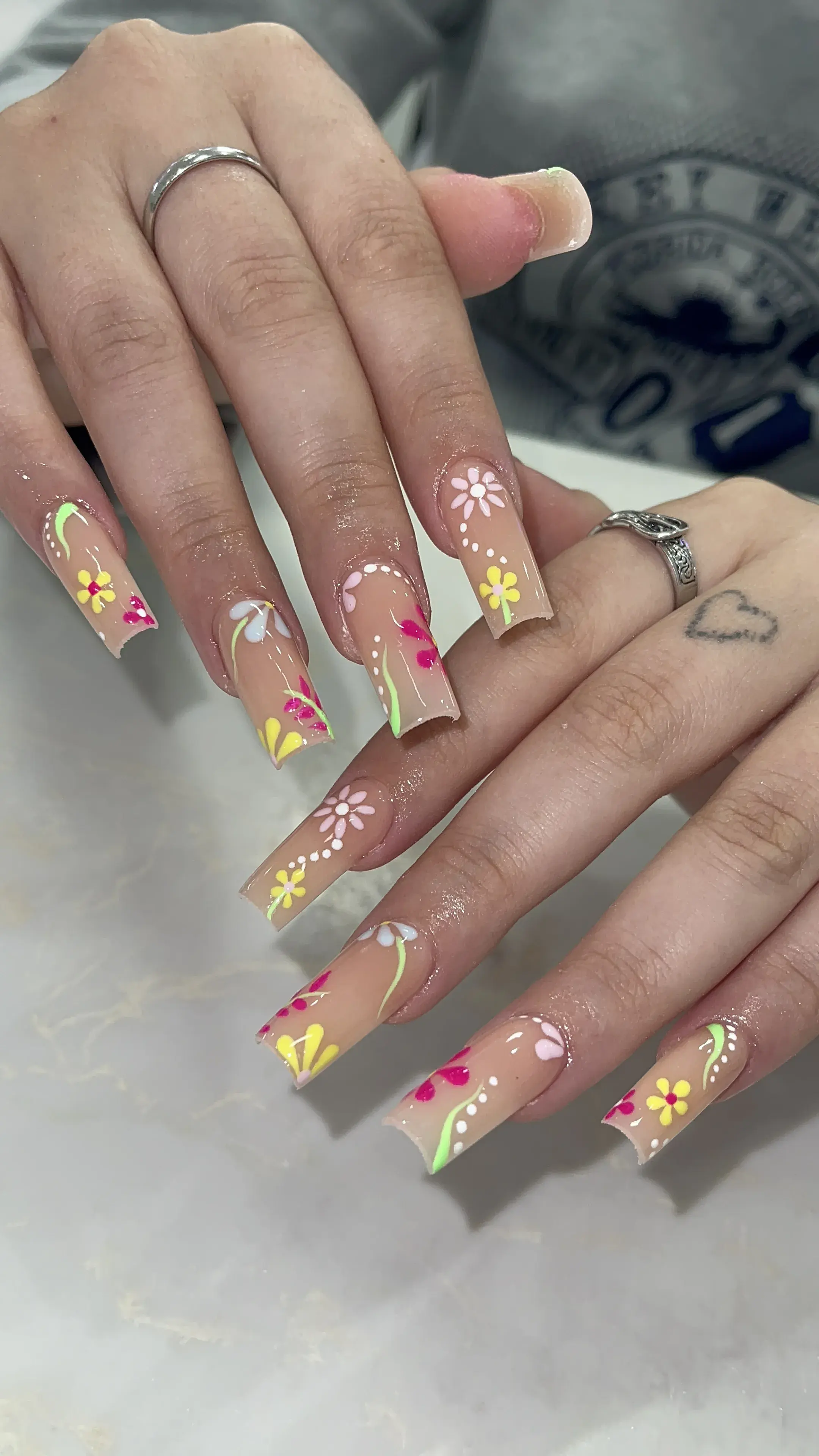 Nude coffin nails with colorful hand-painted flower art