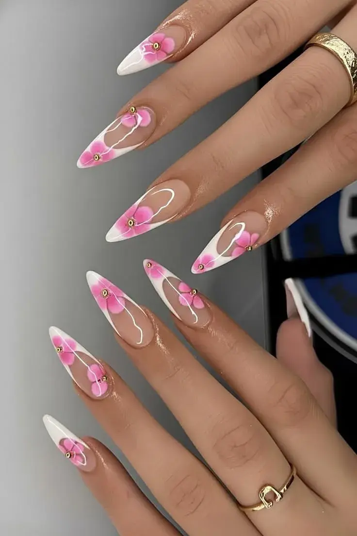 White French tip stiletto nails with pink flowers and gold beads