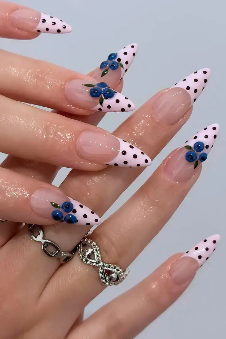 Pink polka dot French tip nails with blue rose art