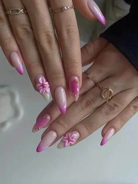 Pink ombre stiletto nails with 3D flowers and gold beads