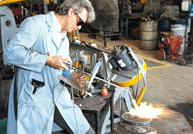 Flame spray metal buildup operation