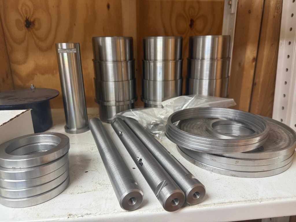 Precision machined parts on shelf
