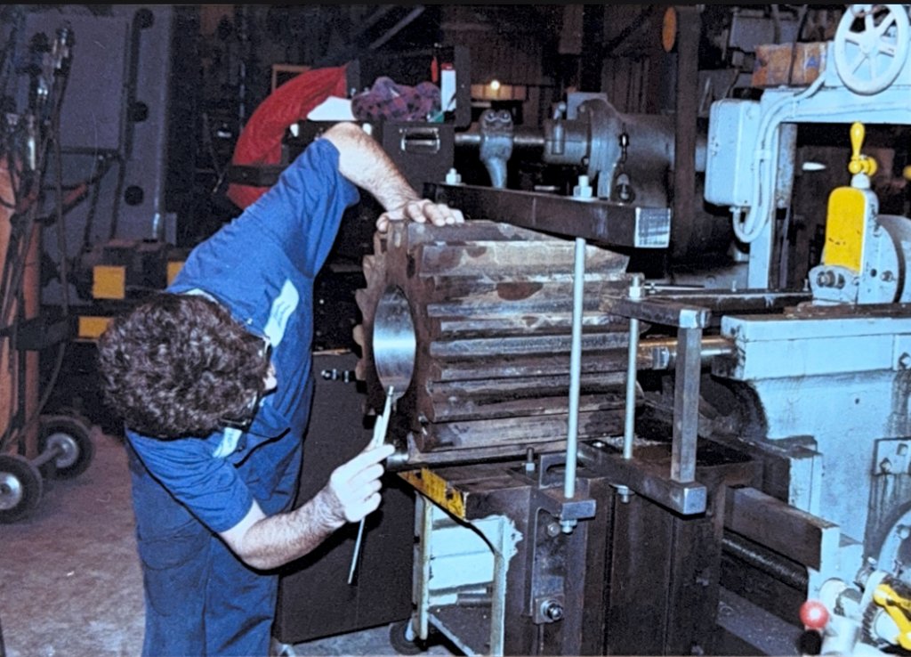 Machinist working on lathe