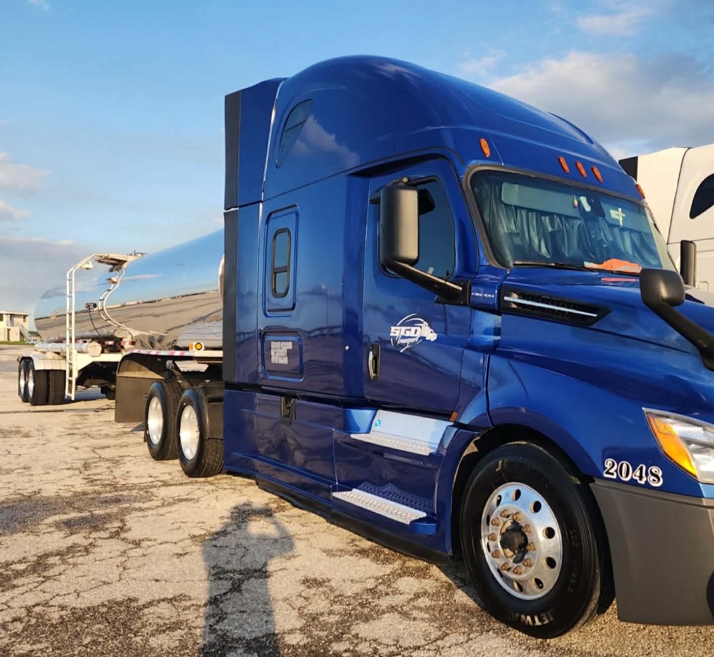 SGD Transport blue Freightliner Cascadia truck 2048 with tanker trailer