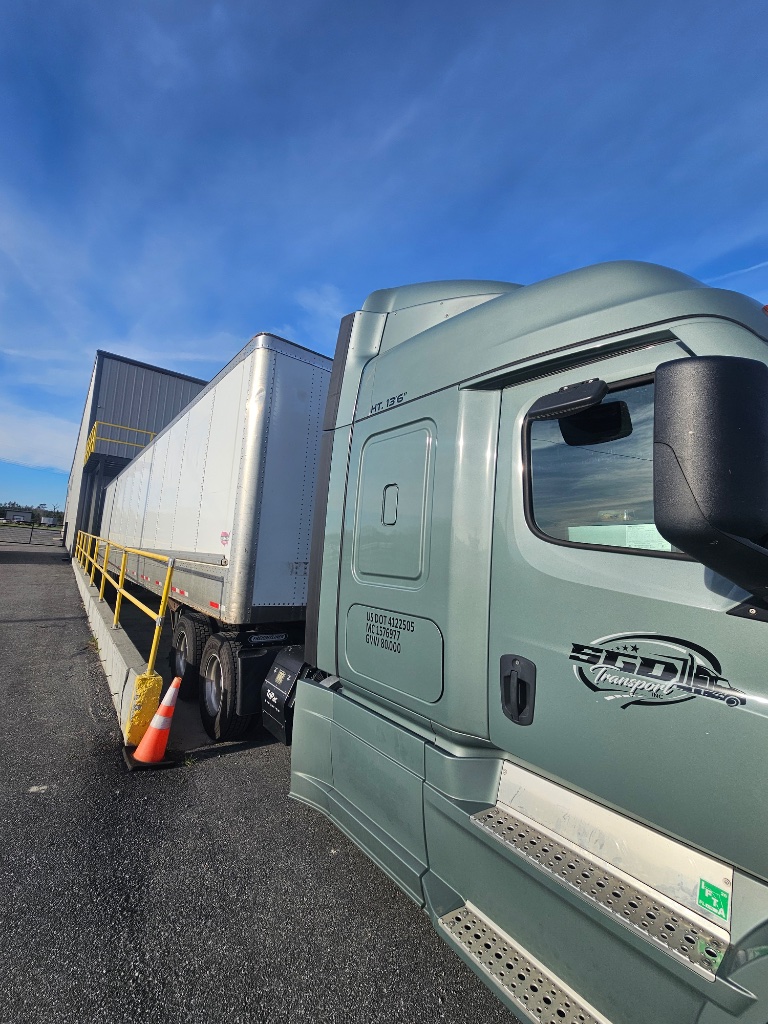SGD Transport black Freightliner Cascadia truck 2138