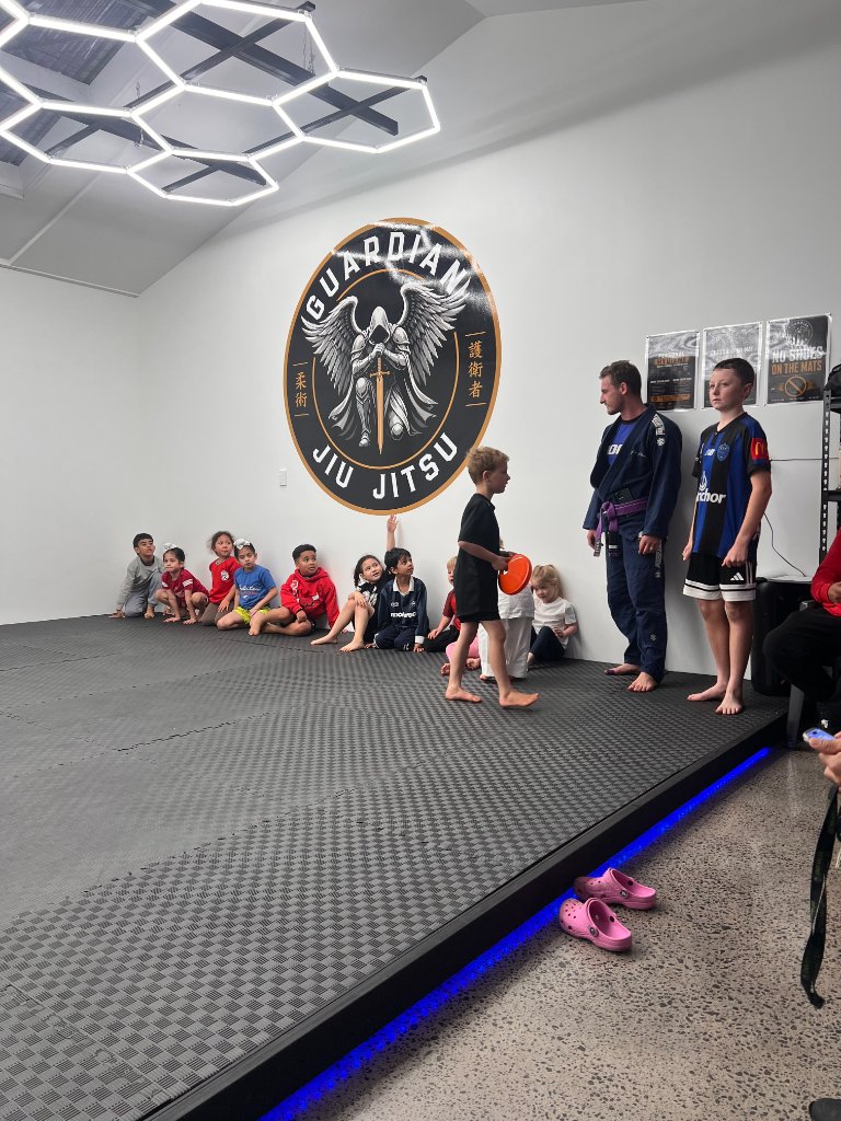 Kids class with instructor at Guardian Jiu Jitsu