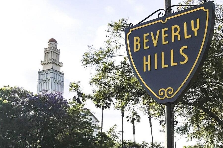 Luxury architectural detail at Beverly Hills — fountain with golden sunlight