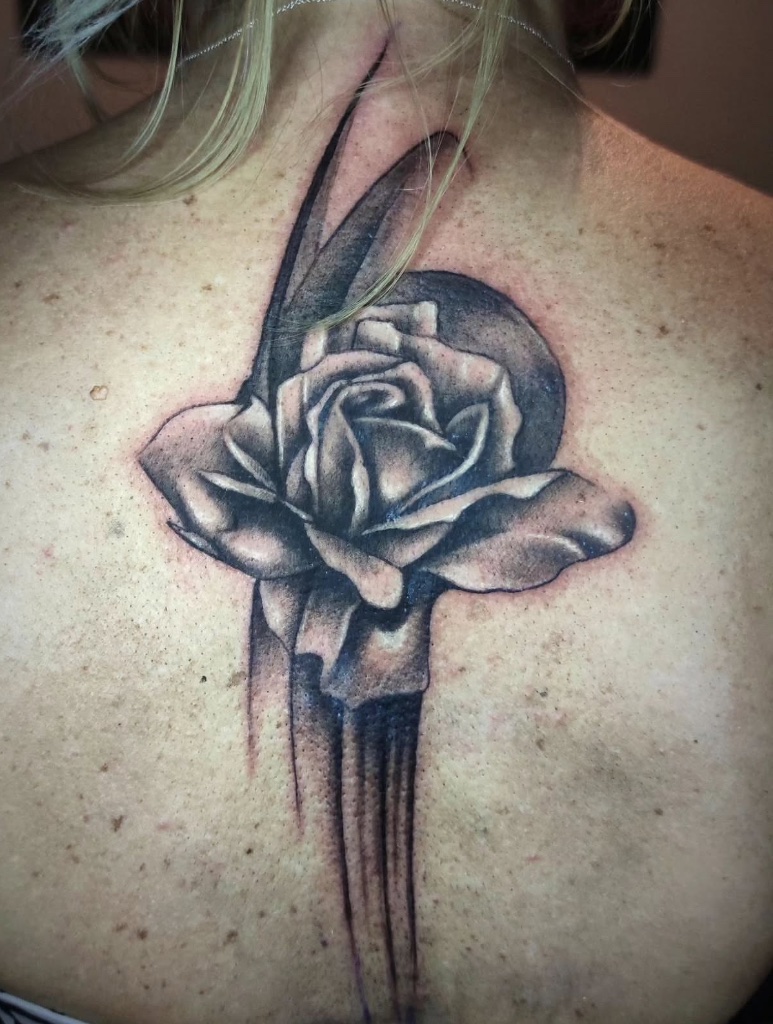 Black and grey rose back tattoo by V01 Ink
