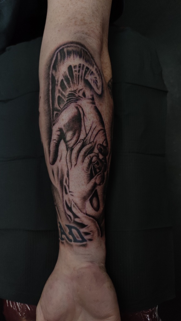 Mountain landscape black and grey forearm tattoo by V01 Ink