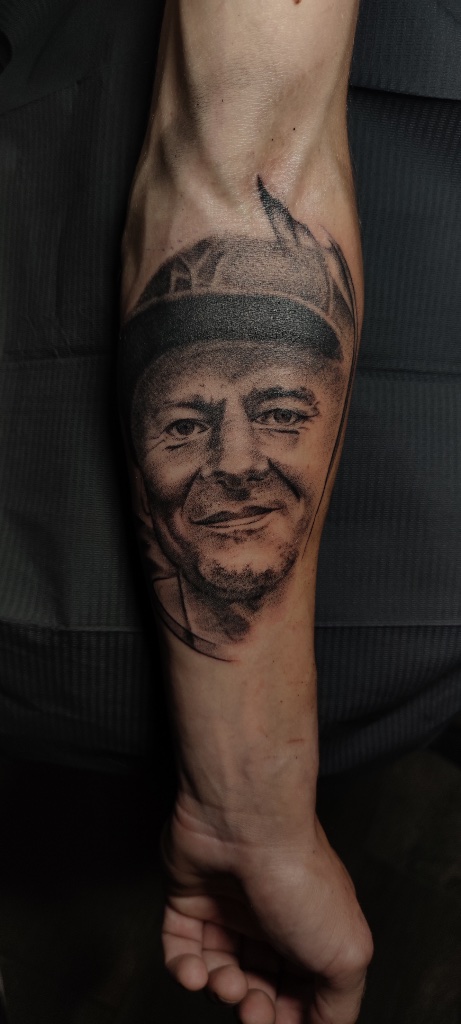 Portrait black and grey forearm tattoo by V01 Ink