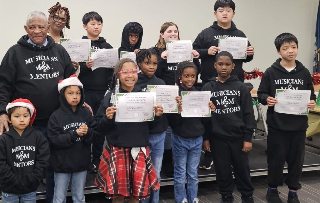 Musicians and Mentors students holding certificates of achievement