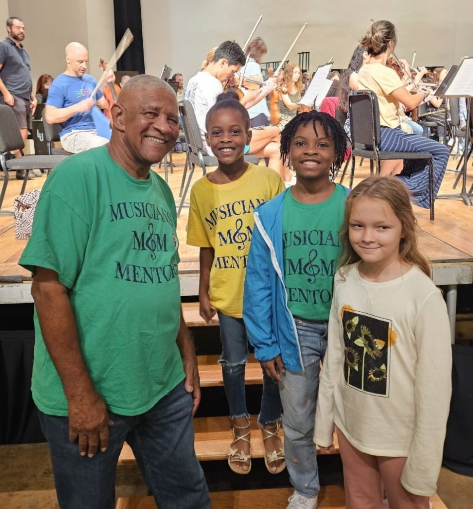 Mentor teaching a student music