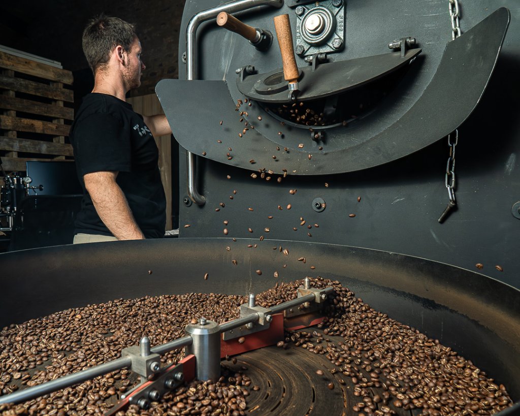 Barista roasting coffee beans