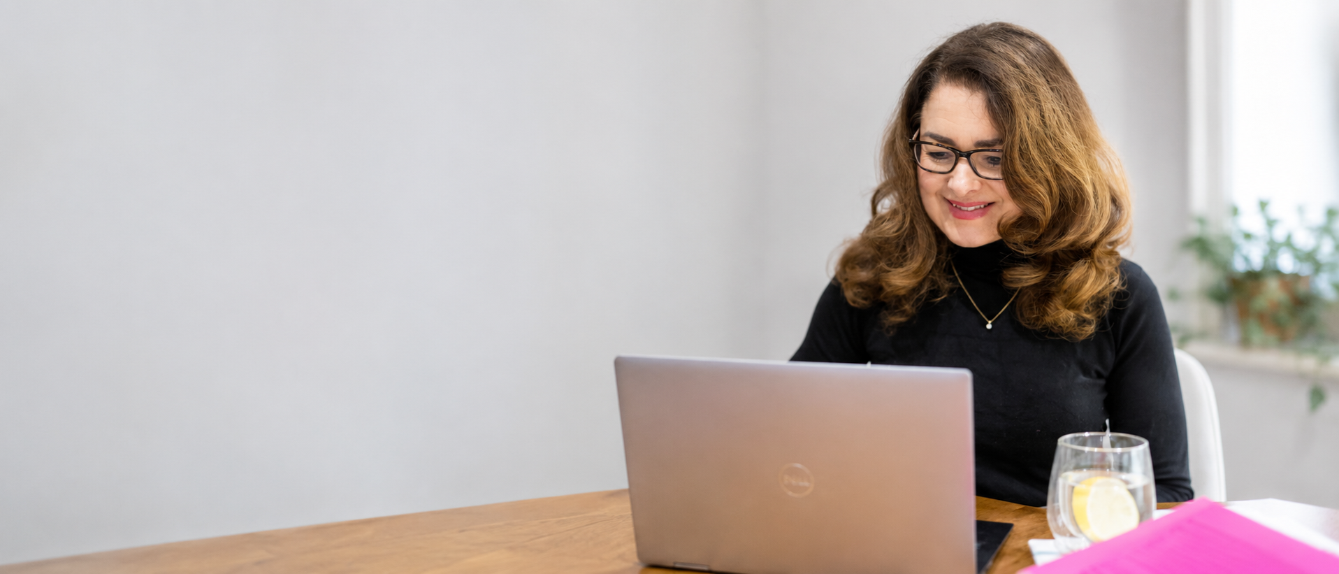 Lucy Childerley working at her desk