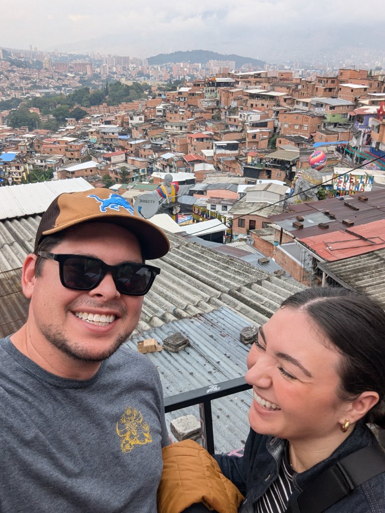 Dr. Brugnone and Lauren laughing while visiting Comuna 13 in Medellin, Colombia on their outreach trip with Solvang Rotart Club and the Linda Vista Foundation in 2026