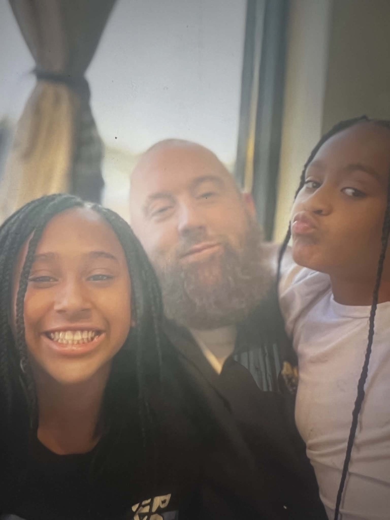 Jason Lewis, founder of One Good Word...One Good Deed, with his daughters