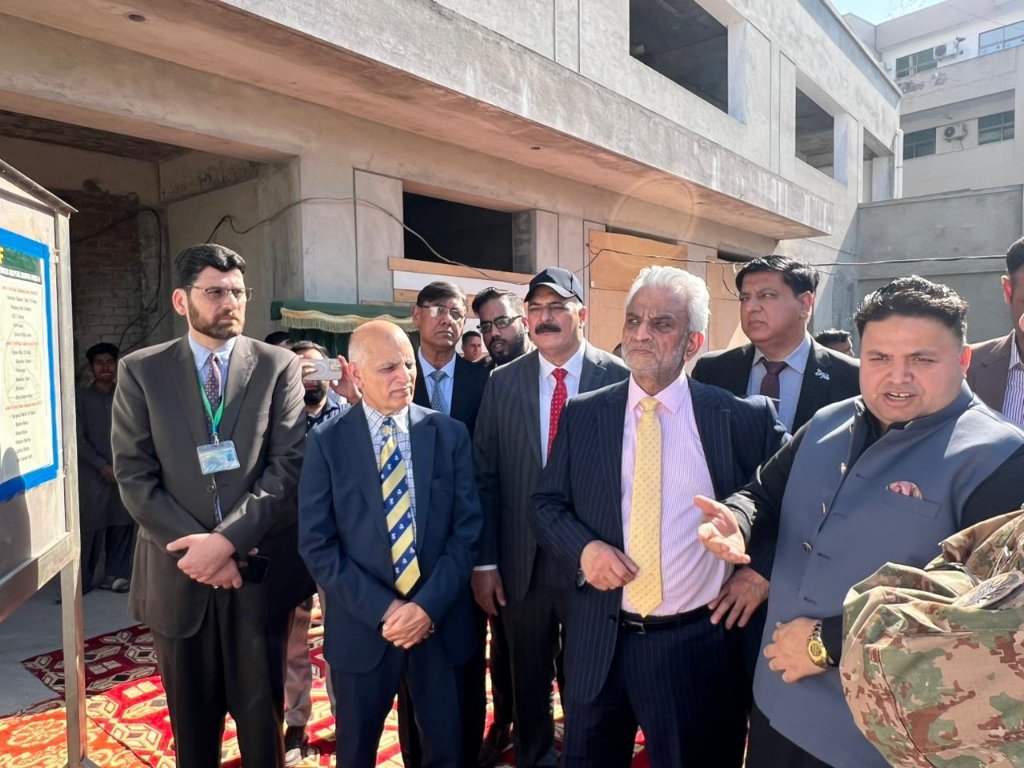Officials touring campus development site