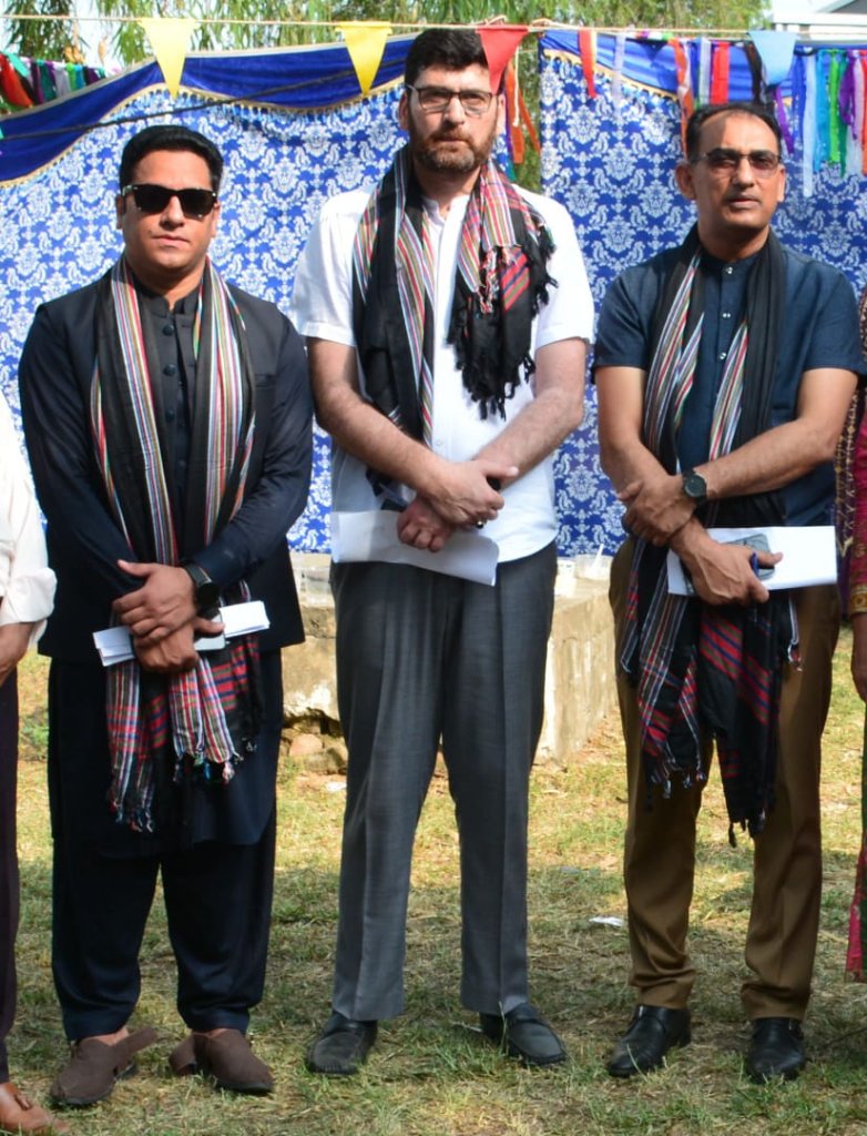 Faculty in traditional Kashmiri attire at cultural day