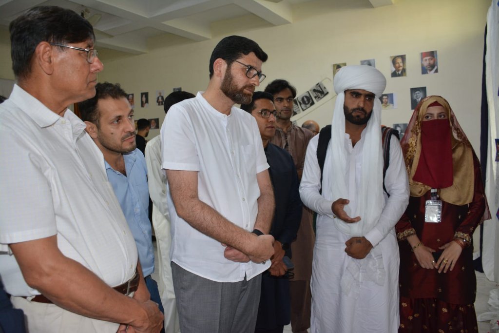 Faculty and students at Publication Society exhibition