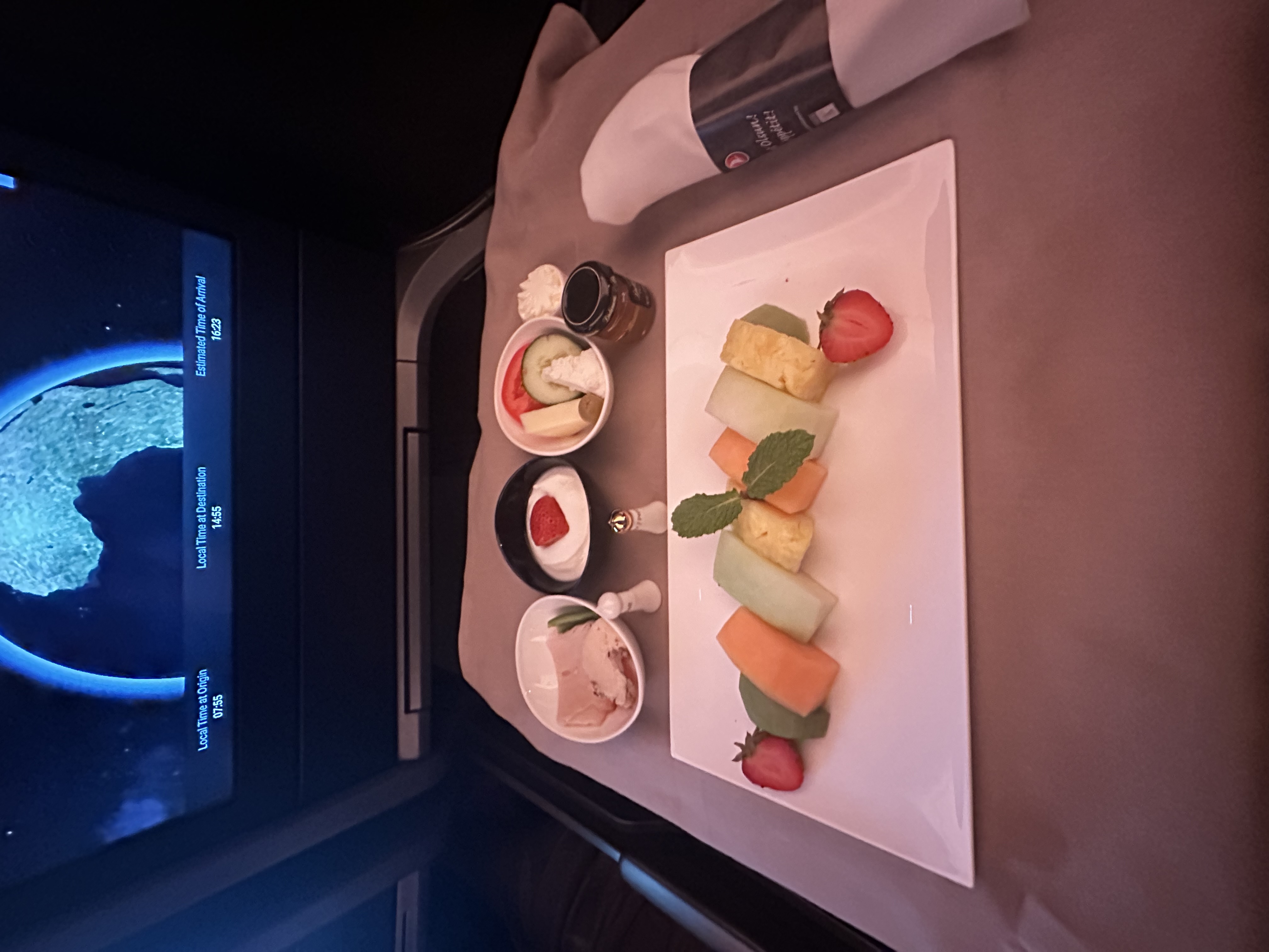 Fresh fruit plate with melon, pineapple and strawberries served for breakfast on Turkish Airlines business class