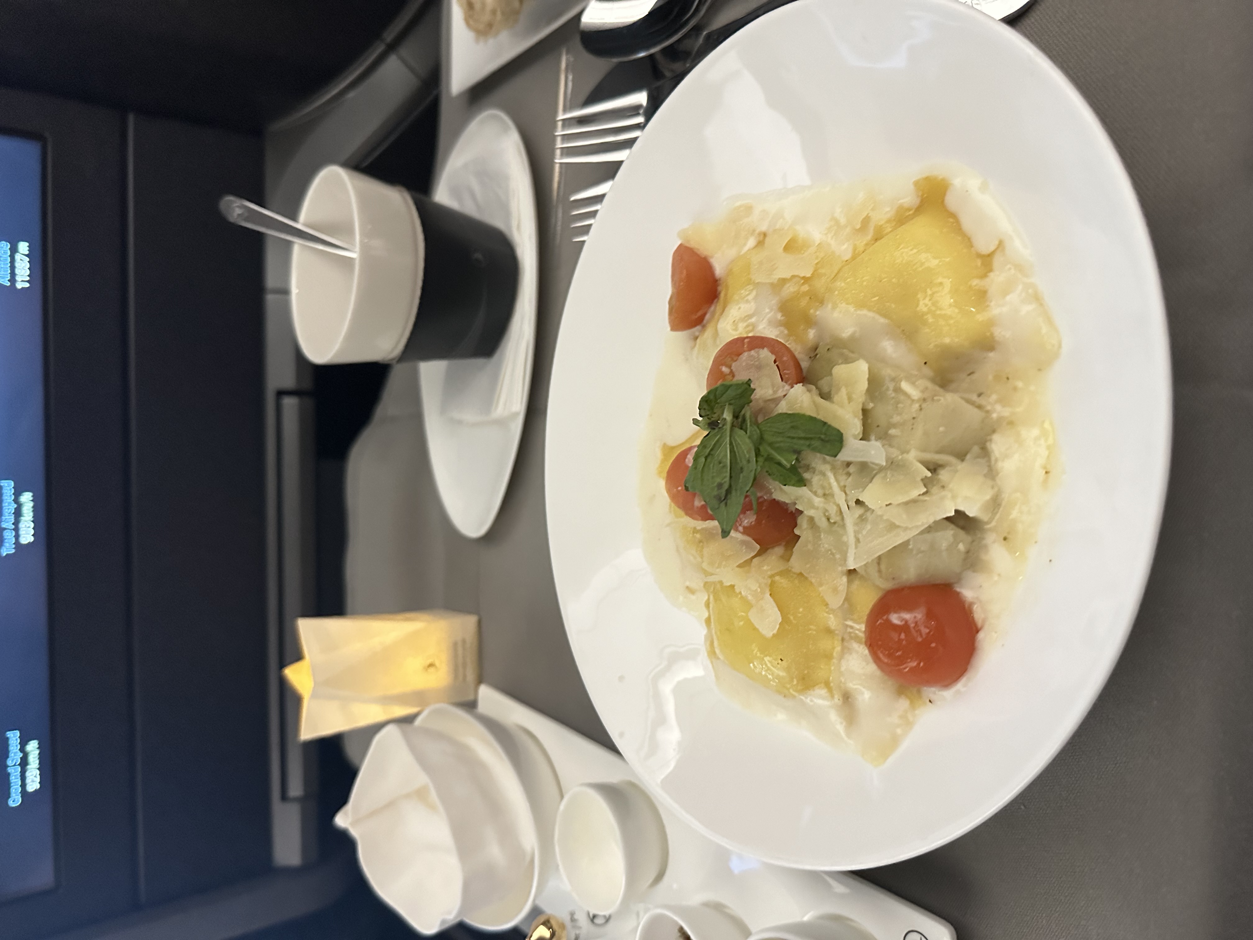 Cheese ravioli with cherry tomatoes and basil served on Turkish Airlines business class