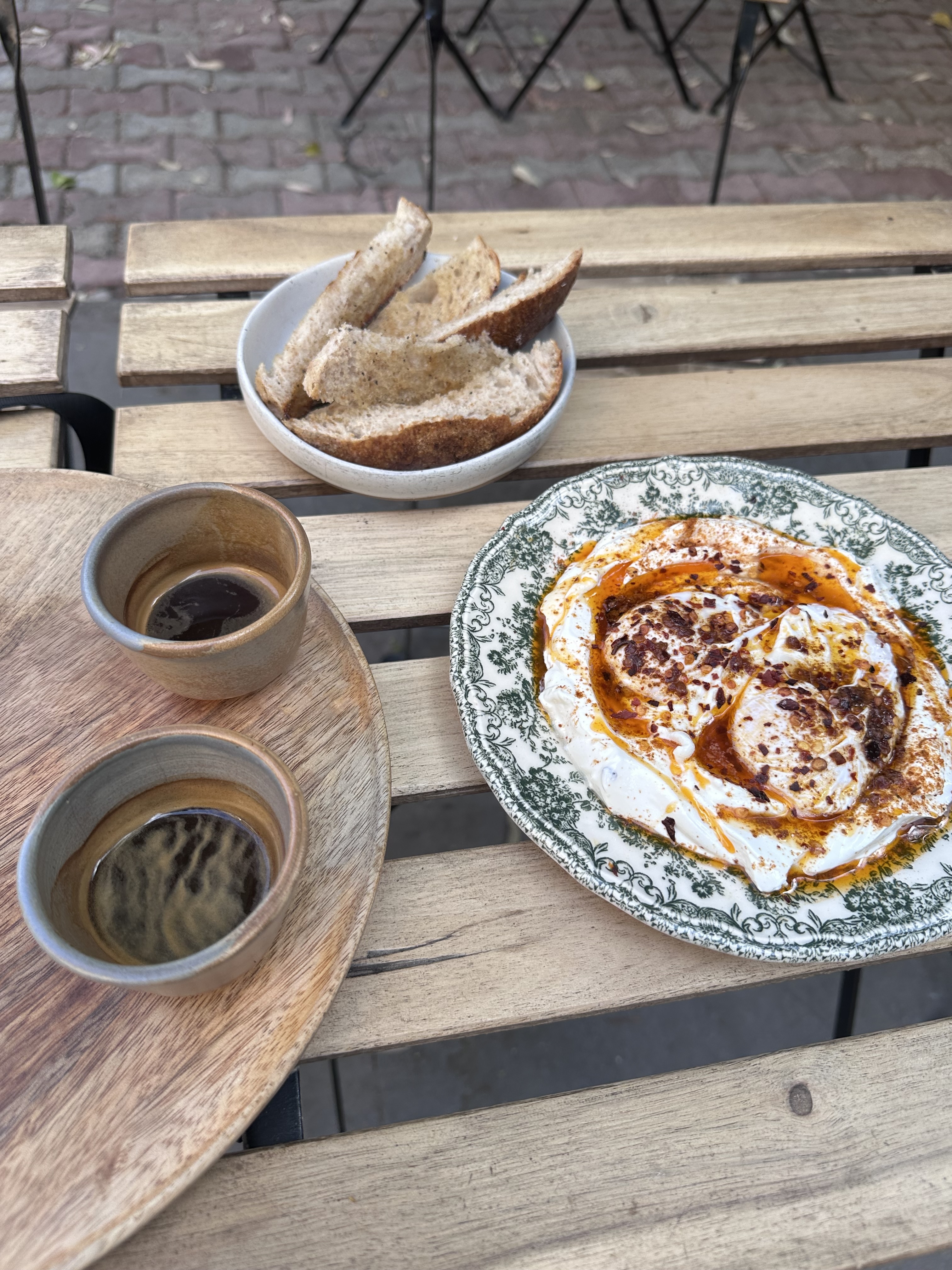 Brunch dish of toast and poached eggs with yogurt at HANA Corner Café