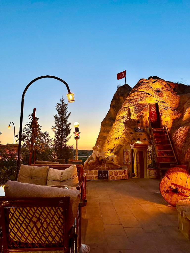 Cave hotel exterior at sunset in Cappadocia, Turkey
