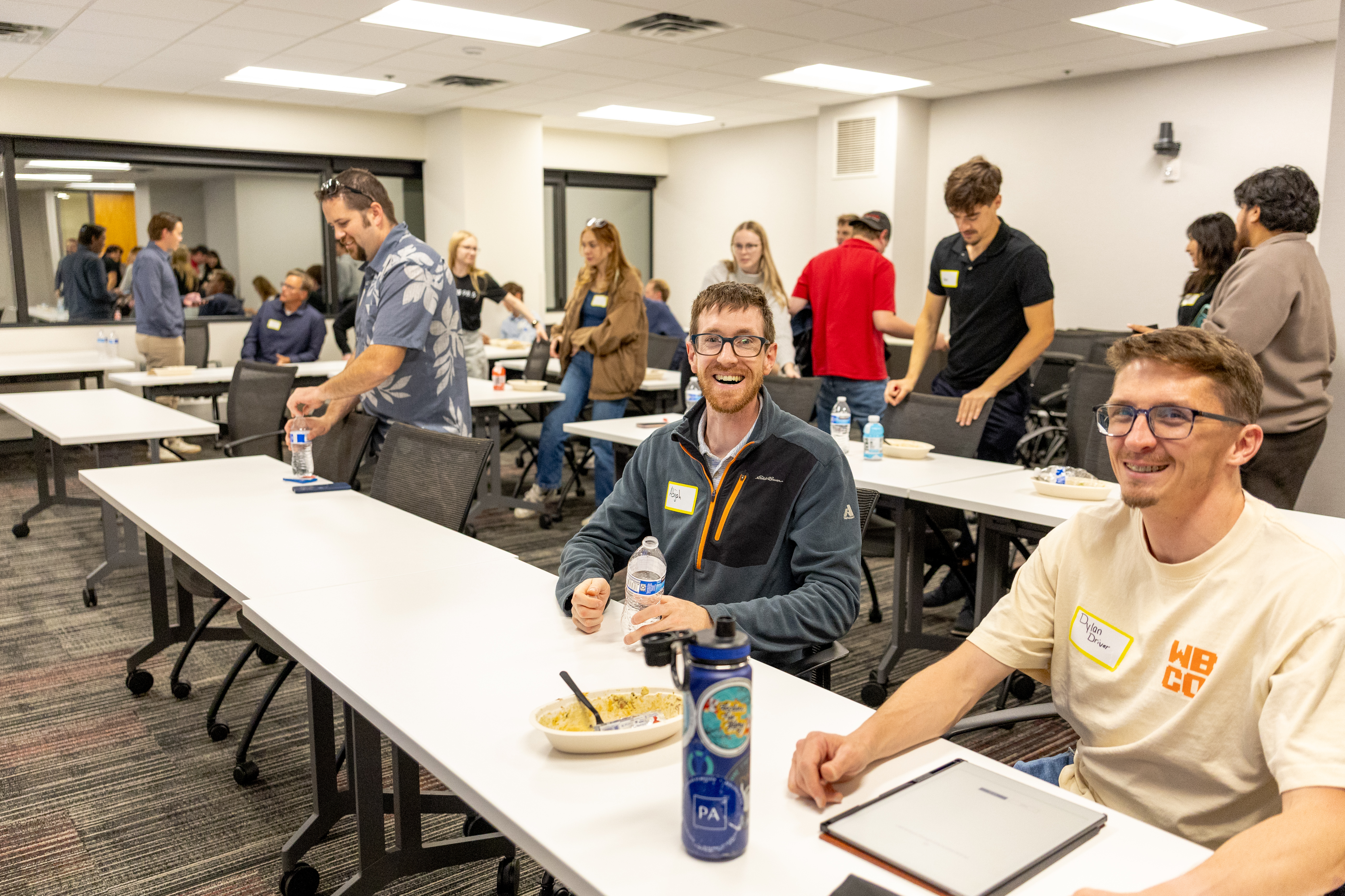 Young professionals seated at a NEW event