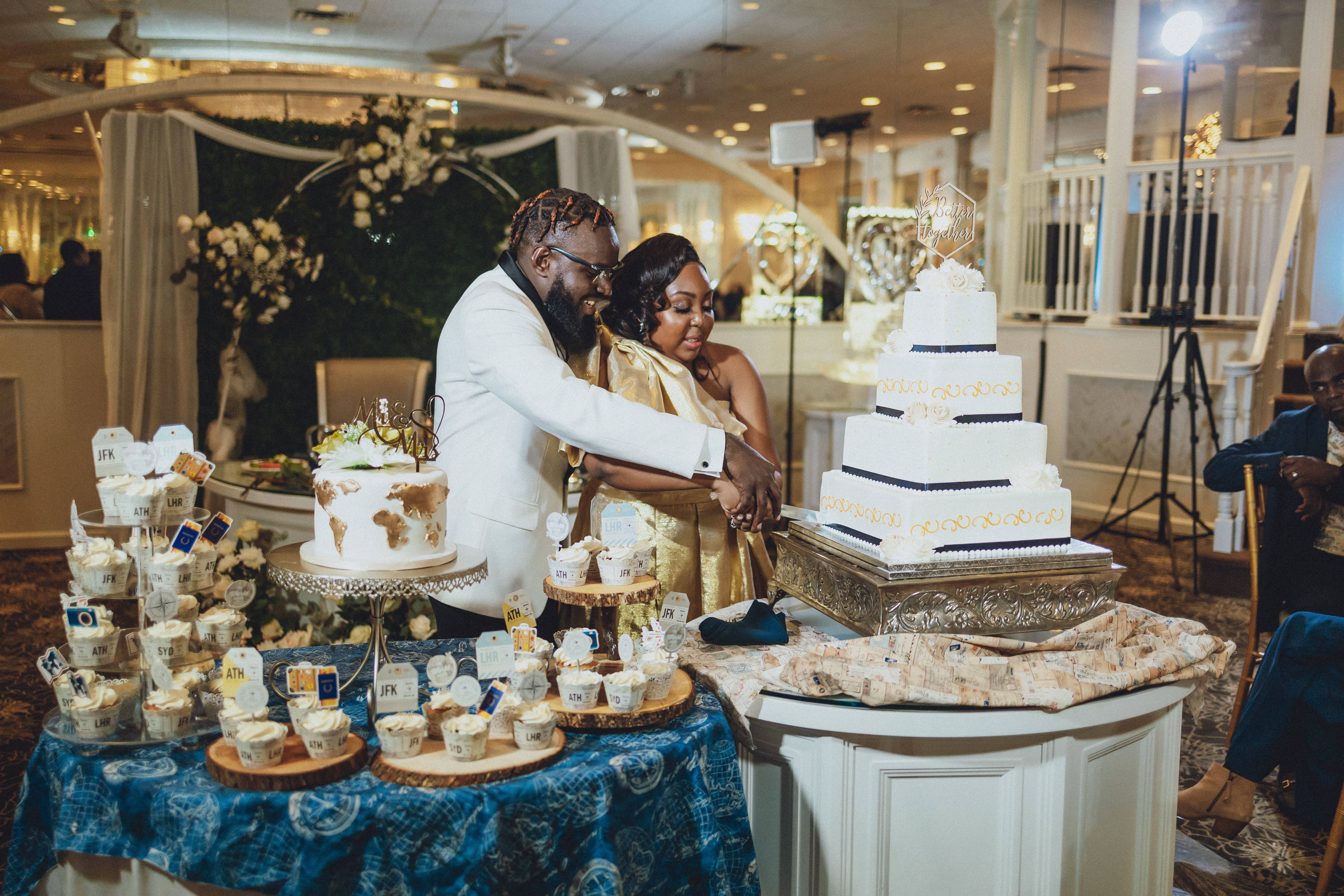 Newlyweds cutting their wedding cake together